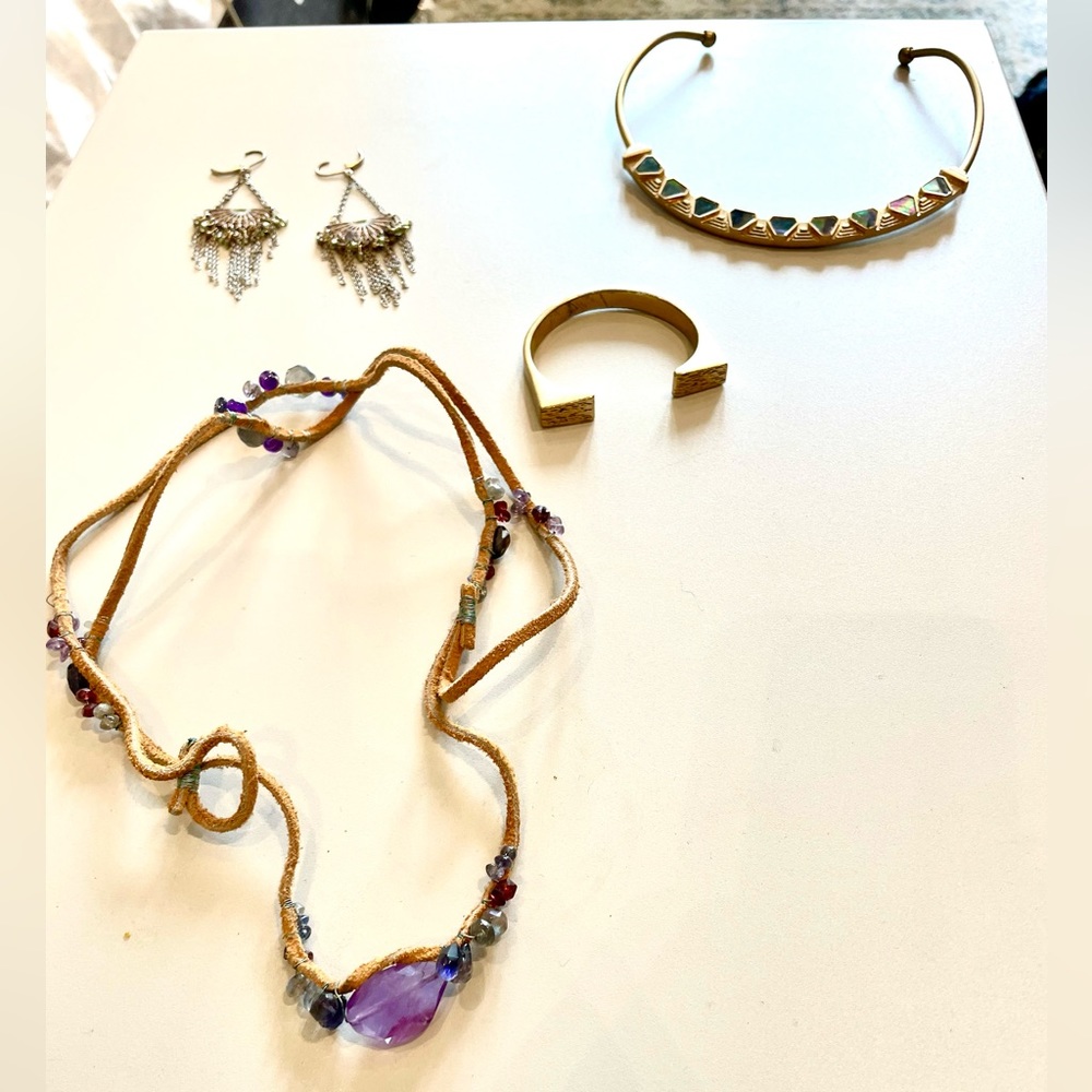 Two necklaces, a bracelet, and earrings